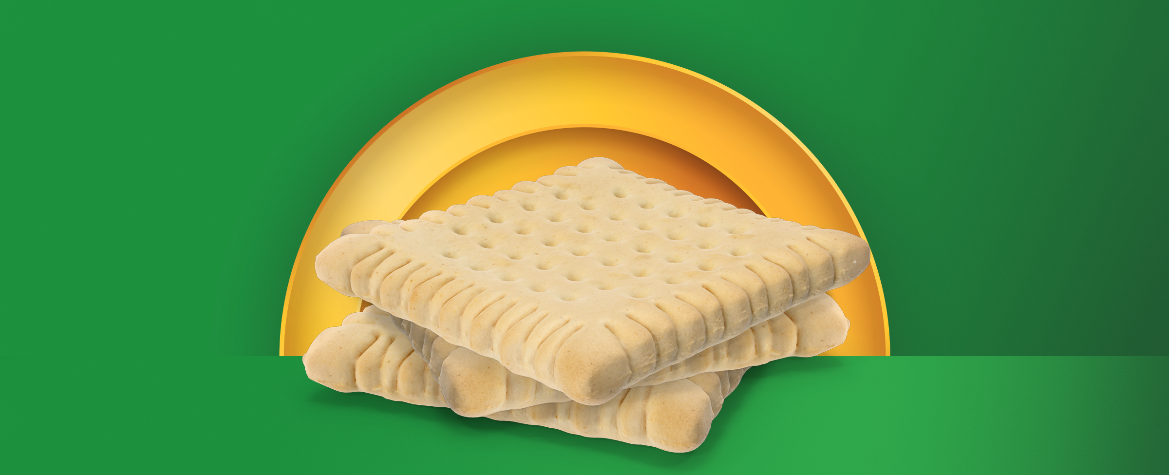 A pile of crackers are centred on a two-tone green background.