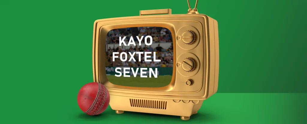 A golden retro television displaying a cricket match with the words "KAYO FOXTEL SEVEN" in bold white letters. A red cricket ball is placed in the foreground on a green background.