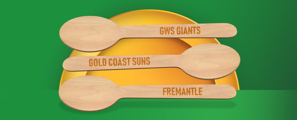 Three wooden spoons display the names of unfortunate teams who have never won the AFL Grand Final. On a green background.